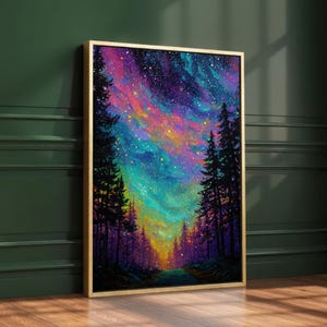 May include: A framed art print showing a colourful night sky with swirling pink, blue, and yellow hues. Silhouetted evergreen trees frame a path leading towards the sky. The frame is gold.