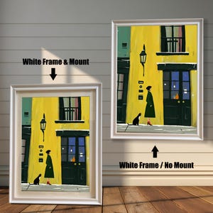 Two framed versions of the wall art print are shown against a white wooden wall. The image on the left, labeled "White Frame & Mount," shows the print with a white mat inside a white frame. The image on the right, labeled "White Frame / No Mount," shows the print directly framed in white without a mat.