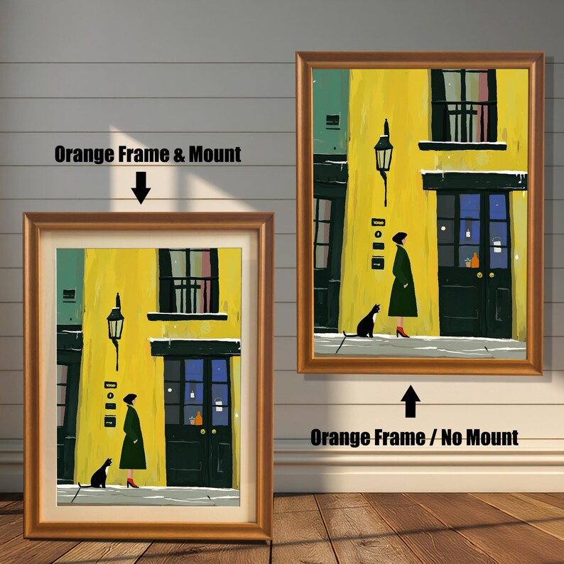 Two framed versions of the wall art print are shown against a white wooden wall. The image on the left, labeled "Orange Frame & Mount," shows the print with a mat inside an orange frame. The image on the right, labeled "Orange Frame / No Mount," shows the print directly framed in orange without a mat.