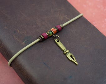 Travelers notebook band, adjustable notebook band with ceramic beads and bronze calligraphy nib charm