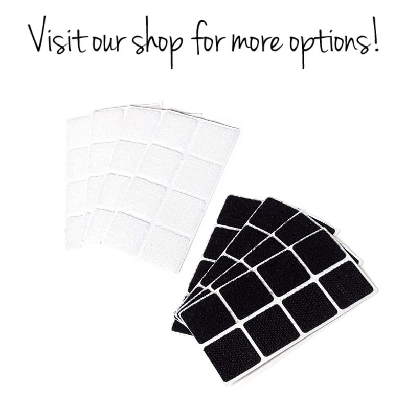 May include: Two sets of adhesive squares, one white and one black. Each set has 16 squares.