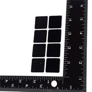May include: A sheet of nine black, square, adhesive hook and loop fasteners. The fasteners are approximately 1 inch by 1 inch.