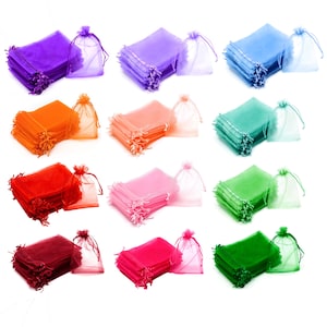 May include: A set of 12 colorful organza bags, each with a drawstring closure. The bags are stacked in rows of four, with each row featuring a different color: purple, light blue, orange, pink, red, light green, burgundy, hot pink, and green.