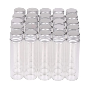 May include: A set of 24 clear glass bottles with silver lids. The bottles are arranged in a rectangular grid.