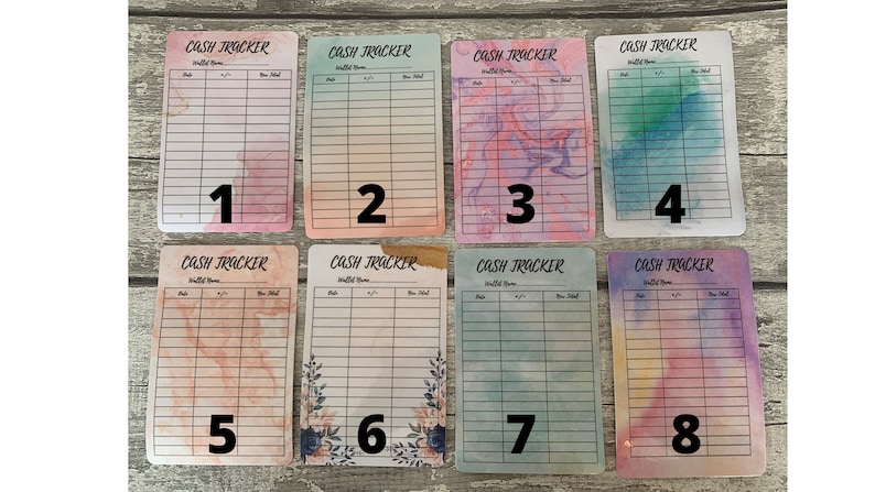 May include: Eight colorful cash tracker cards with watercolor backgrounds. Each card has a different design, including pink, blue, purple, and green hues. The cards are labeled with the text "CASH TRACKER" and numbered 1 through 8.