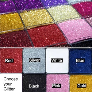 May include: A selection of glitter colors in small containers. The colors include red, silver, white, blue, black, pink, and gold. Choose your glitter color.