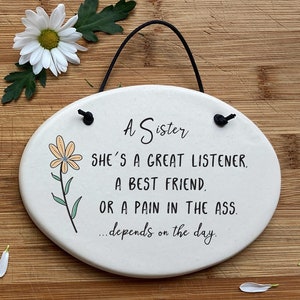 Funny little sister, bossy big sister friend gift. A Sister. She's a great listener, a best friend, or a pain in the ass, Depends on the day
