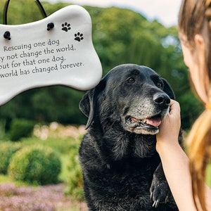 Rescuing one dog may not change the world but for that one dog the world has changed forever. Handmade ceramic hanging dog bone plaque by August Ceramics Gifts