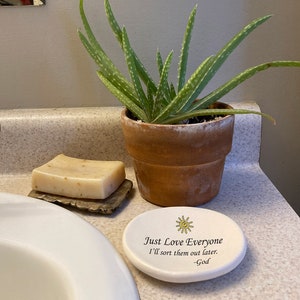 May include: White ceramic dish with a yellow sun design and the text "Just Love Everyone I'll sort them out later. -God".