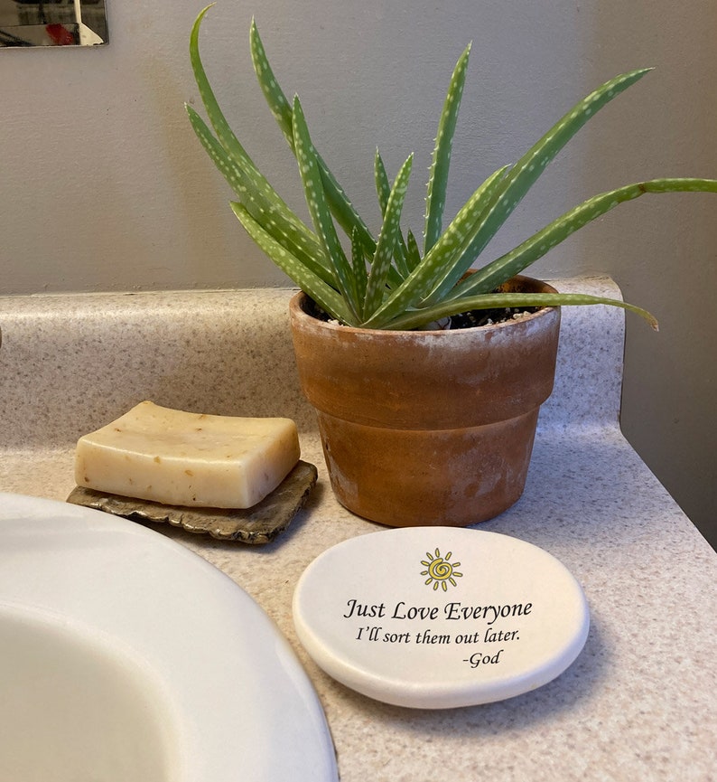 May include: White ceramic dish with a yellow sun design and the text "Just Love Everyone I'll sort them out later. -God".