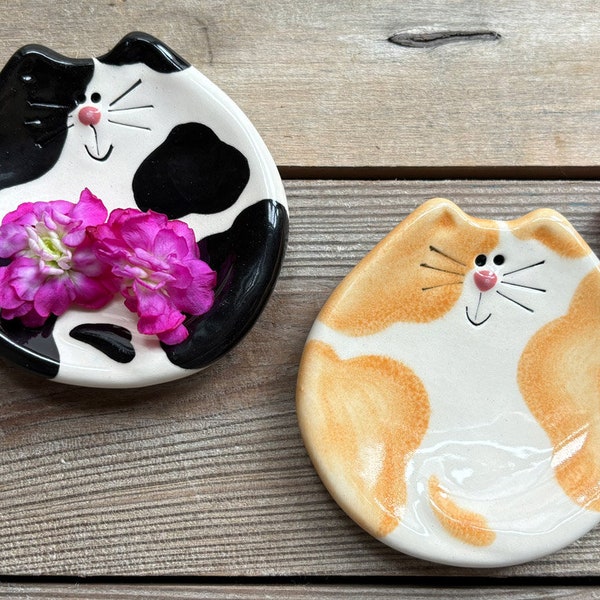 Spotted and calico cat tea holder, spoon rest, soap dish or a jewelry dish: These happy ceramic kitty dishes make great gifts for a cat mom.