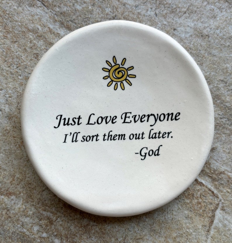 May include: White ceramic dish with a yellow sun design and the text "Just Love Everyone I'll sort them out later. -God"