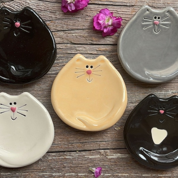 Happy cat dish colors- solid black cat, gray cat, yellow cat, white cat. They can be used as tea bag holders, spoon rests or ring dishes.