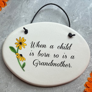 New Grammy plaque. "When a child is born so is a Grandmother." Handmade ceramic ornament, tea bag holder, coffee spoon rest or garden art.