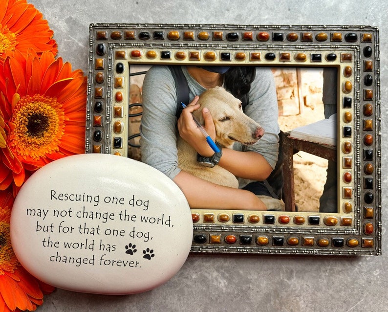 Rescuing one dog may not change the world but for that one dog the world has changed forever. Handmade ceramic garden stone by August Ceramics Gifts