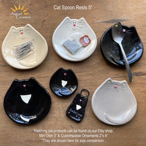 Ceramic cat dish that works nicely as a tea bag rest, spoon rest, soap dish & more. Yellow, White, Gray, Black and Tuxedo colored dishes.