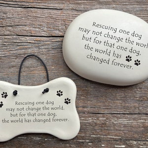 Rescuing one dog may not change the world but for that one dog the world has changed forever. Handmade ceramic garden stone and hanging dog bone plaque by August Ceramics Gifts