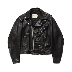 May include: Black leather motorcycle jacket with a zipper closure, a belt, and multiple pockets. The jacket has a label that reads "Altalet" in red lettering.