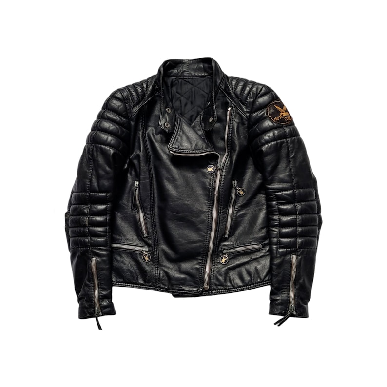 May include: Black leather motorcycle jacket with quilted detailing and a zipper closure. The jacket has a patch on the right shoulder that says "Royal  Club".
