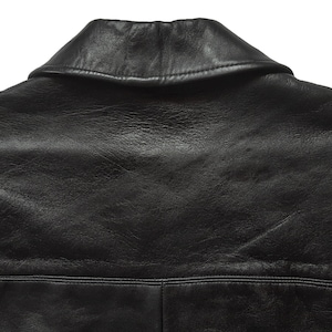 May include: Black leather jacket with a classic collar and a smooth, textured surface.