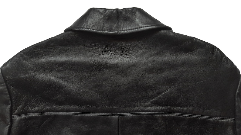 May include: Black leather jacket with a classic collar and a smooth, textured surface.