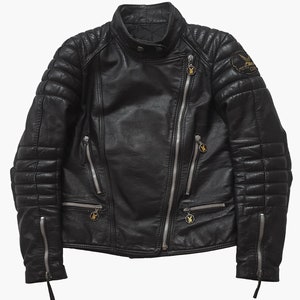 May include: Black leather motorcycle jacket with quilted detailing and zipper accents. The jacket has a zipper closure and a patch on the right sleeve that says "Moto Club".