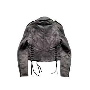 May include: A gray leather jacket with a lace-up detail on the back. The jacket has a zipper closure and long sleeves.
