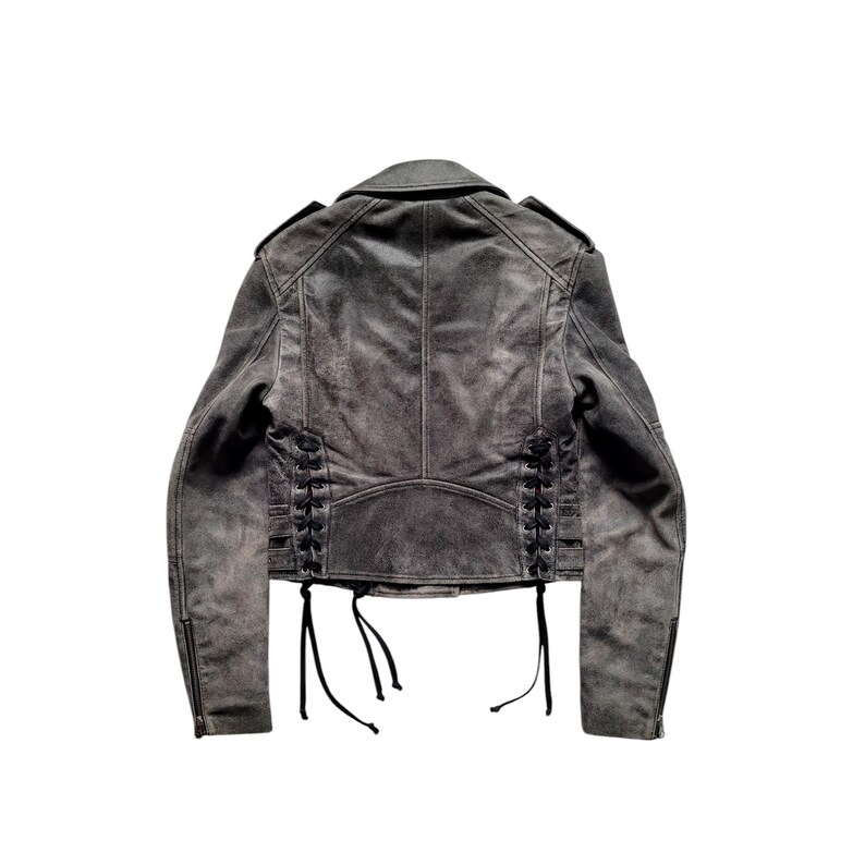 May include: A gray leather jacket with a lace-up detail on the back. The jacket has a zipper closure and long sleeves.