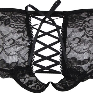 May include: Black lace underwear with a criss-cross ribbon detail in the back.