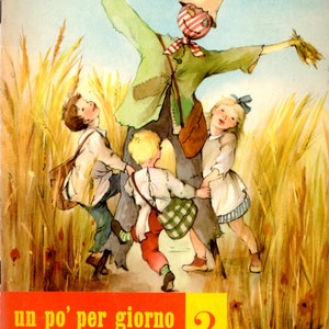 May include: A vintage book cover illustration featuring a scarecrow in a field of wheat with three children. The book title is "un po' per giorno 2" and the subtitle is "COMPITI PER LE VACANZE SECONDO VOLUMETTO".