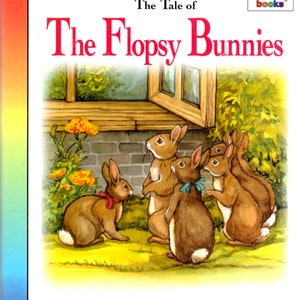 May include: A children's book cover featuring an illustration of five brown bunnies with white tails, standing in front of a window. The book title is "The Flopsy Bunnies" and the text "The Tale of" appears above the title. The book is published by "rainbow books".