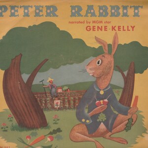May include: A vintage book cover featuring a cartoon rabbit holding radishes and carrots. The cover is yellow with green trees and a blue sky. The title "PETER RABBIT" is in large, bold letters with red dots. The text "narrated by MGM star GENE KELLY" is in smaller letters below the title.