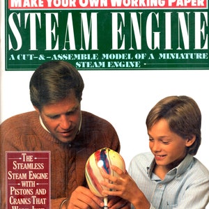 May include: A book cover with a green background and the title "Make Your Own Working Paper Steam Engine". The cover features a father and son building a steam engine model. The text on the cover reads "The Seamless Steam Engine with Pistons and Cranks That Work Just Like The Real Thing."