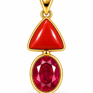 May include: A gold pendant featuring a triangular red stone at the top and an oval faceted red gemstone at the bottom. The pendant has a polished gold bail at the top, with gold settings framing both stones, creating a vertical two-part design.