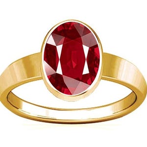 May include: A gold ring set with a large, oval ruby gemstone.