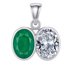 May include: A silver pendant featuring two oval-cut gemstones. One is a vibrant green emerald, and the other is a sparkling, clear diamond. The pendant has a polished finish and a loop for a chain.