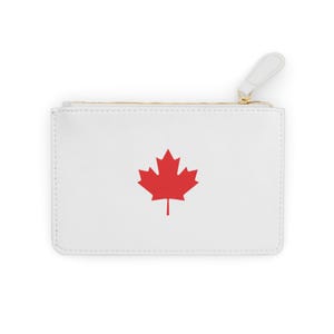 May include: White zippered pouch with a red Canadian maple leaf design.