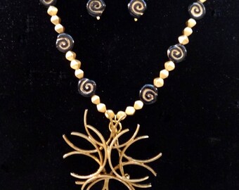 Unusual. Unique. Handmade Necklace and Earring Set. Gold Metal Abstract Pendant. Gold Czech Glass  Beads and Black Glass with Gold Swirl.