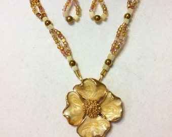 Charming. Handmade Necklace and Earring Set. Enameled Dogwood Flower in Cream and Gold. Beads are Quartz, Glass and Gold Plated.