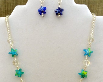 Seeing Stars. Handmade Necklace and Earring Set. Cobalt and Teal Stars with a touch of yellow. Crystal.