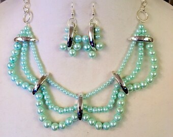 Elegant. Handmade Necklace and Earring Set. Soft Green Glass Pearls. Silver Plated Sliders. Three Strands. Scalloped Design.