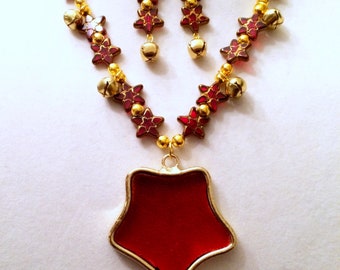 Playful. Bells that jingle. Handmade Necklace and Earring Set. Red Glass Star Pendant framed in gold.