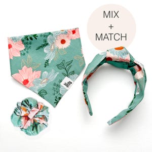 May include: A matching set of accessories featuring a floral pattern in shades of teal, pink, and white. The set includes a bandana, a scrunchie, and a knotted headband. The text "MIX + MATCH" is in a white circle.