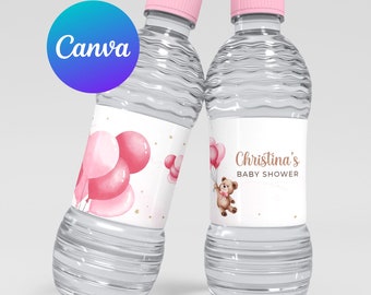 May include: Two clear plastic water bottles with pink lids and labels. The labels feature a pink and white watercolor design with balloons and a teddy bear. One label reads "Christina's Baby Shower".