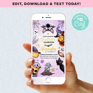 May include: A smartphone displays a Halloween-themed invitation. The invitation features a ghost, bat, witch, pumpkin, and black cat. Text includes "Spooktacular Celebration" and event details. The phone is held in a hand.