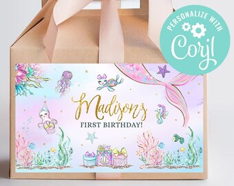 May include: A brown favor box with a mermaid-themed label. The label features a pink, blue, and green watercolor background with a mermaid tail, seahorses, and a starfish. The text on the label reads "Madison's First Birthday!" and "Personalize with Caryl!"