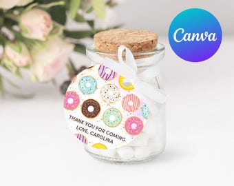 May include: A small glass jar filled with white candy and a round donut-themed favor tag that says "Thank you for coming Love, Carolina".