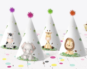May include: Four white party hats with different animal designs. The hats have a green, purple, orange, and pink pom-pom on top. The animals are a zebra, elephant, giraffe, and lion.