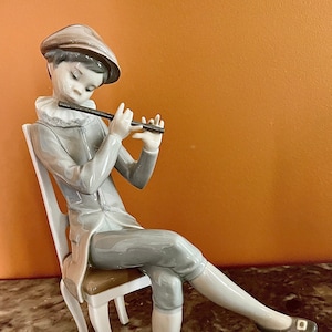 Retired Lladró Boy with Flute #4877, “Nino Flautico,” with original box from Spain