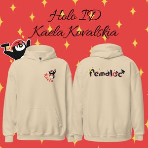 May include: A beige hoodie with a penguin graphic on the front and the text "Remaloc" on the back. The hoodie has a red background with yellow stars.
